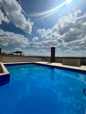 Dpto con piscina , asador & terraza
